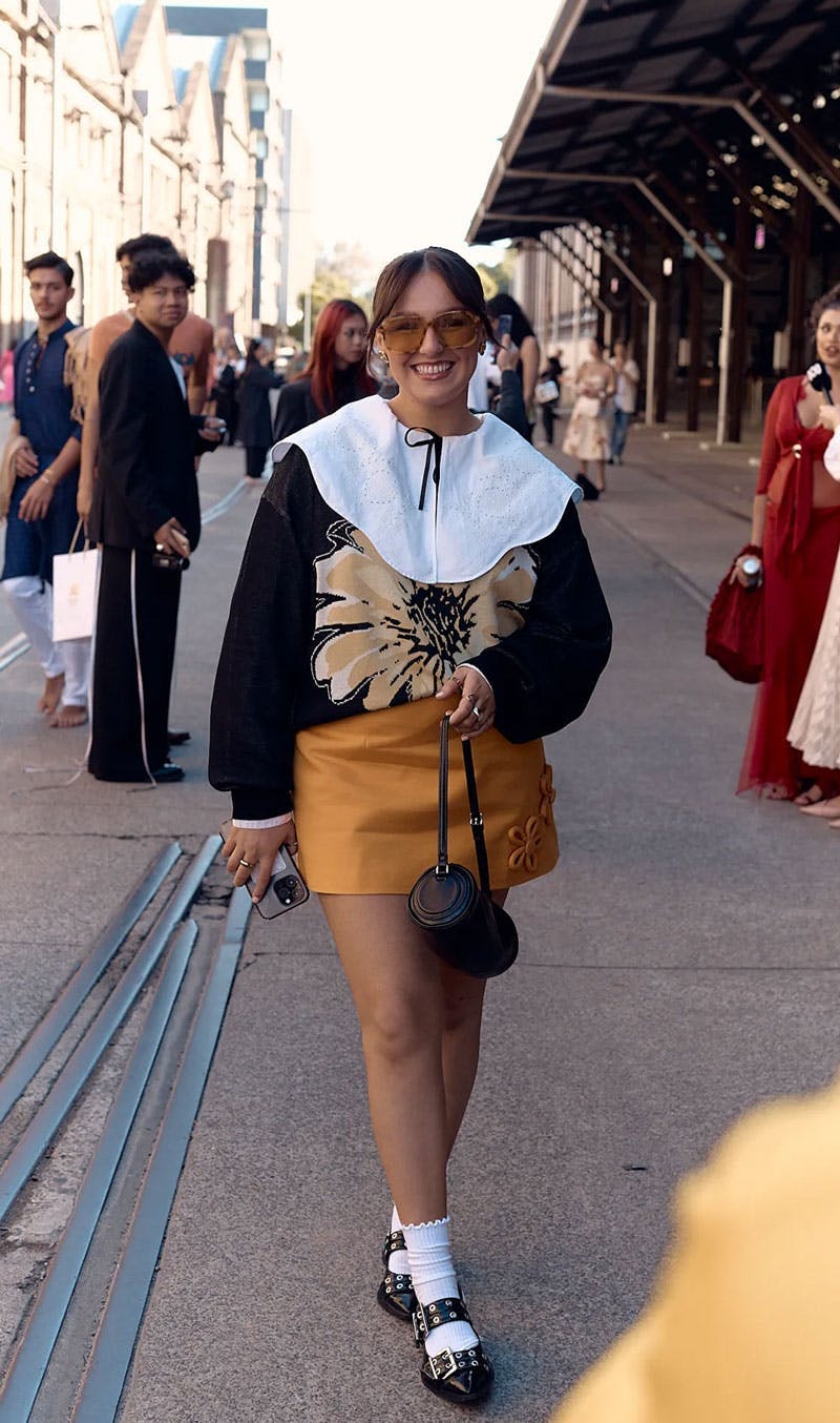 Woman wearing Lu Goldie sunglasses