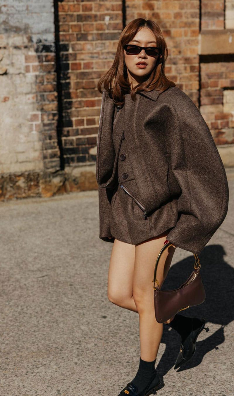 Woman wearing Saint Laurent Shade sunglasses